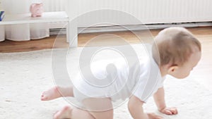 Happy little baby crawling in living room at home 23