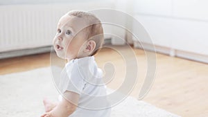 Happy little baby crawling in living room at home 9