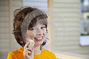 Happy little boy eating an ice cream