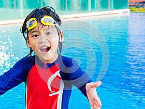 Happy little boy has fun and enjoy in the swimming pool