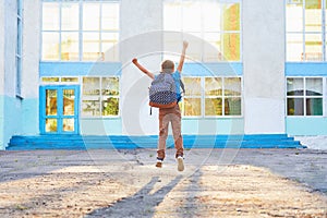 Happy little boy, high jumped with joy, the beginning of the school year.happy child goes to primary school. positive attitude to