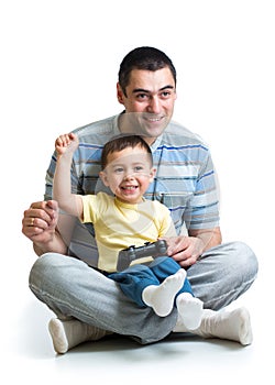 Happy little boy and his dad playing with a playst