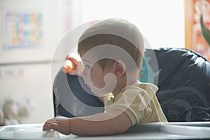 Happy little boy holding a carrots. Concept of healthy food.