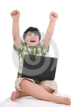 Happy little boy with laptop