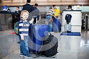 Happy little boy with luggage