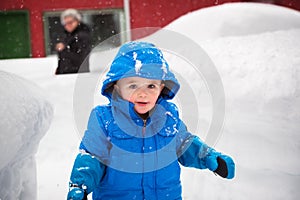 Happy Little Boy Outside on a Snowy Day