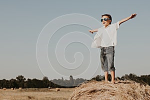 Happy little boy playing  in the park at the day time