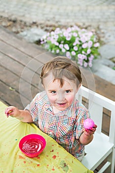 Happy Little Boy Poses with his Dyed Pink Easter Egg