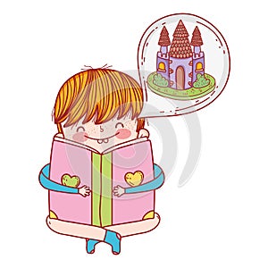 Happy little boy reading book with castle