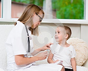 Happy little boy receiving injection or vaccine