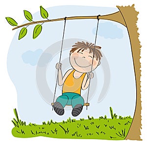 Happy little boy sitting on swing, swinging under the tree