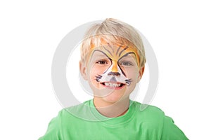 Happy little boy in tiger face paint