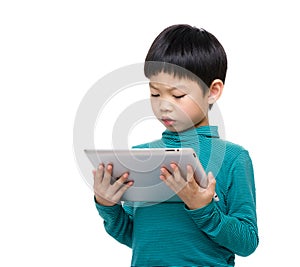 Happy little boy using tablet