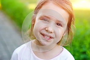 Happy little caucasian baby girls showing front teeth with big smile