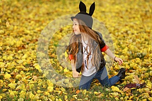 Happy little child, baby girl laughing and playing in the autumn on the nature walk outdoors.