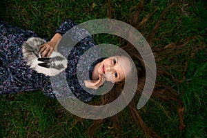 Happy little child girl with cute rabbit. Portrait of kid with pet