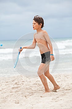 Happy little child kid boy playing beachball