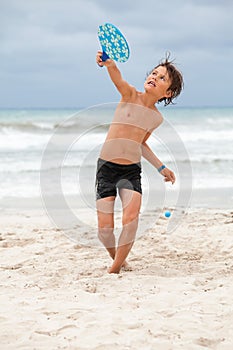 Happy little child kid boy playing beachball