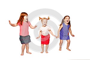 Happy little children dancing and jumping