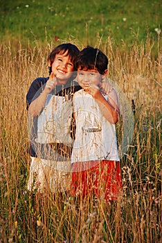 Happy little children in grass