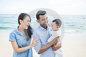 Happy little family vacation on the beach