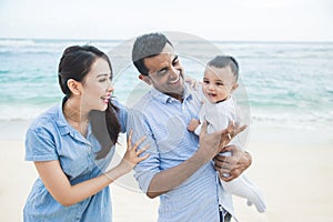 Happy little family vacation on the beach