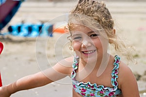 Happy little girl on the beach