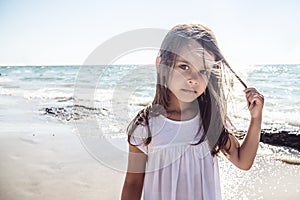 Happy little girl on the beach