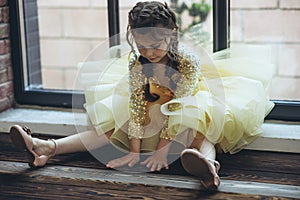 Happy little girl in a beautiful dress.