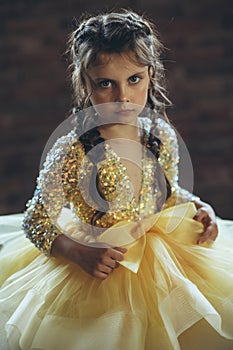 Happy little girl in a beautiful dress.