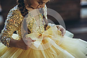 Happy little girl in a beautiful dress.