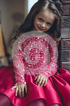 Happy little girl in a beautiful dress.