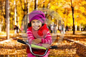 Happy little girl on bicycle