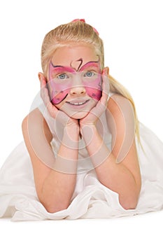 Happy little girl in butterfly face paint