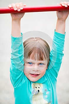 Happy little girl child at playground