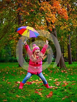 Girl with a colorful umbrella outdoor