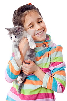Happy little girl cuddle kitten photo