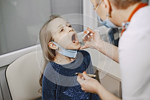 Happy little girl at the doctor for a checkup