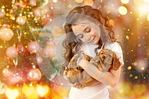Happy little girl and dog beside Christmas tree. New year 2018. Holiday concept, Christmas, New year background.