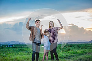 Happy little girl e with asian family  enjoying road trip and summer vacation