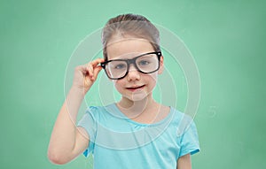 Happy little girl in eyeglasses