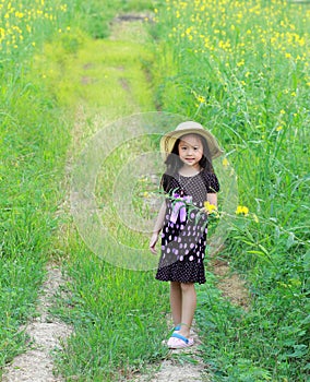 happy little girl in a field