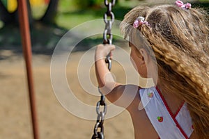 Happy little girl five years old wearing summer dress having fun