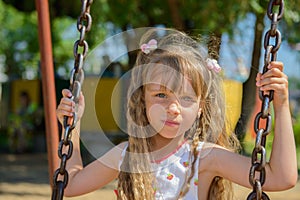 Happy little girl five years old wearing summer dress having fun