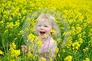 Happy little girl with flowers