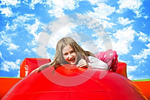 Happy Sunny Girl on Inflate Castle photo