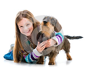 Happy little girl with her â€‹â€‹dachshund