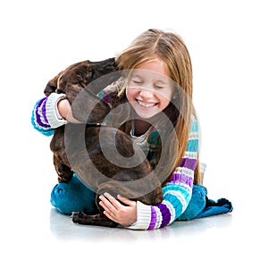 Happy little girl with her â€‹â€‹dachshund