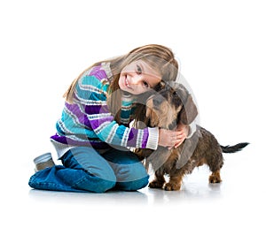 Happy little girl with her â€‹â€‹dachshund