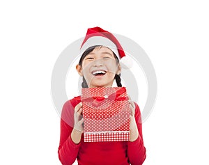 Happy little girl holding christmas gift